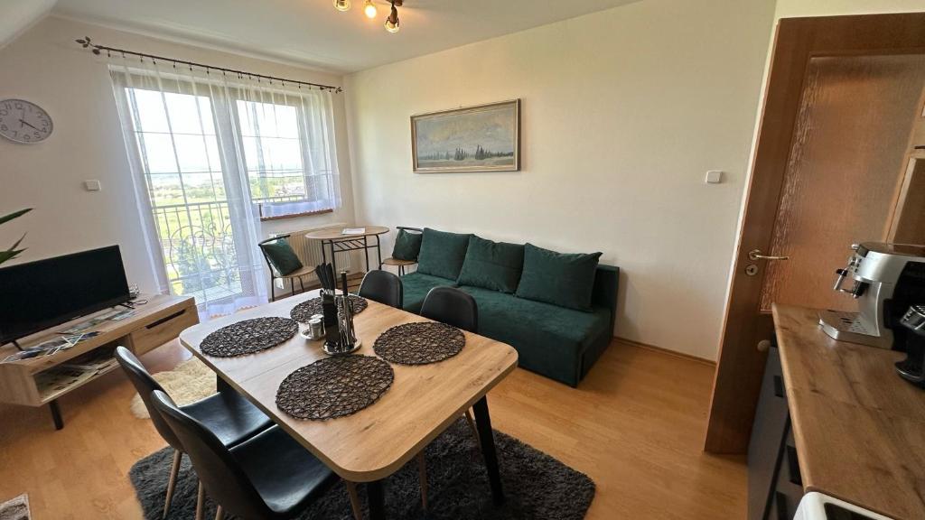 A television and/or entertainment centre at 2 room Apartment Nela, with a view of the mountains