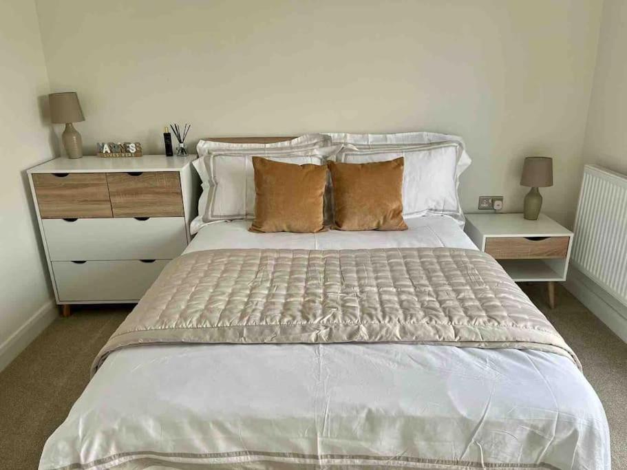 a bedroom with a large white bed with pillows at Modern 3 Bed Town House Marina Hull in Hull