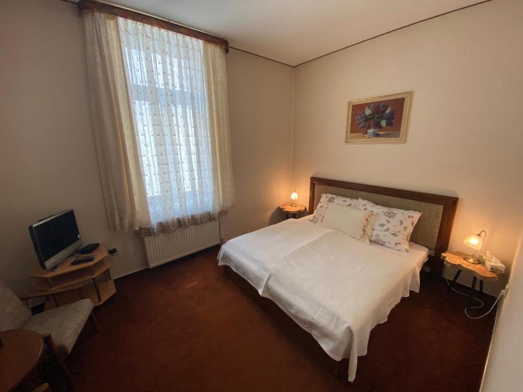 Postel nebo postele na pokoji v ubytování Penzión TATRA INN