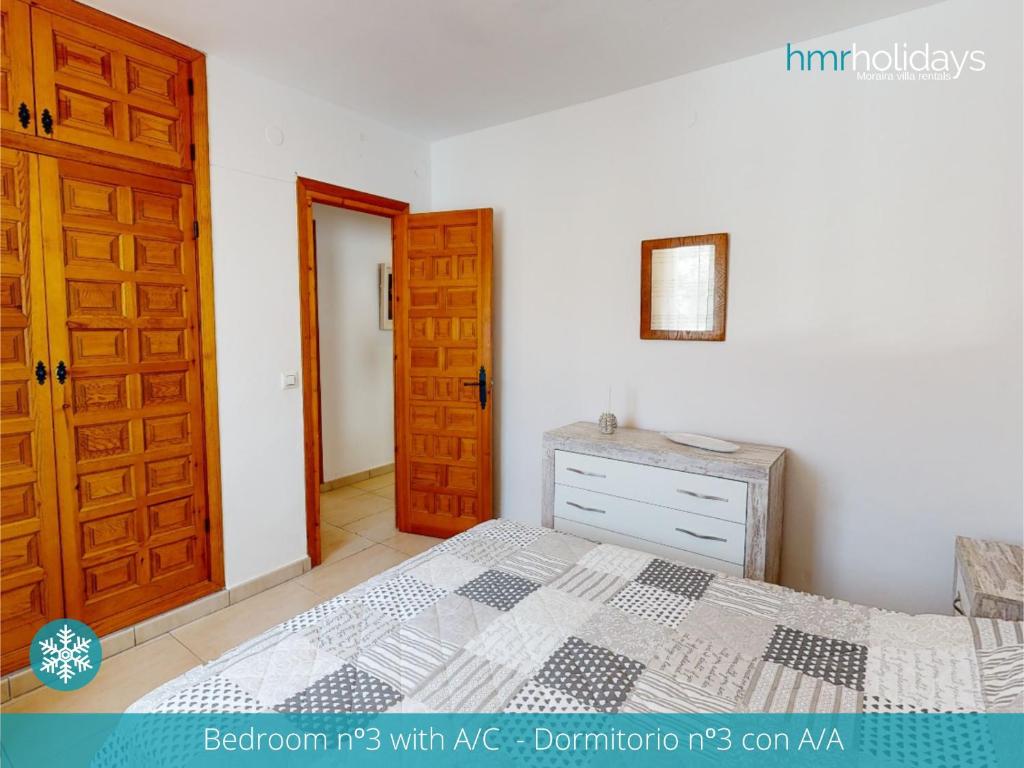 Postel nebo postele na pokoji v ubytování Villa Portina by HMR Holidays