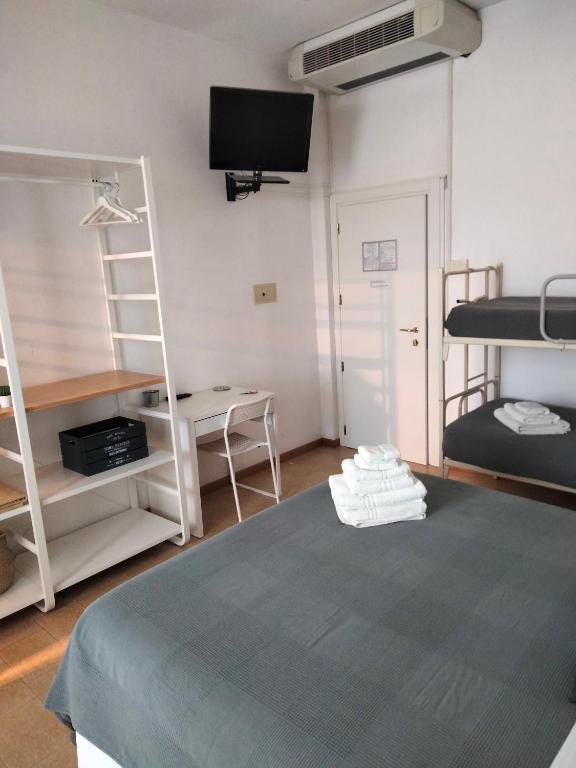 Postel nebo postele na pokoji v ubytování Albergo Aquila