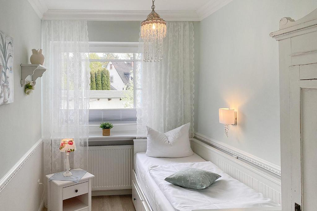 Postel nebo postele na pokoji v ubytování Haus Midsommer