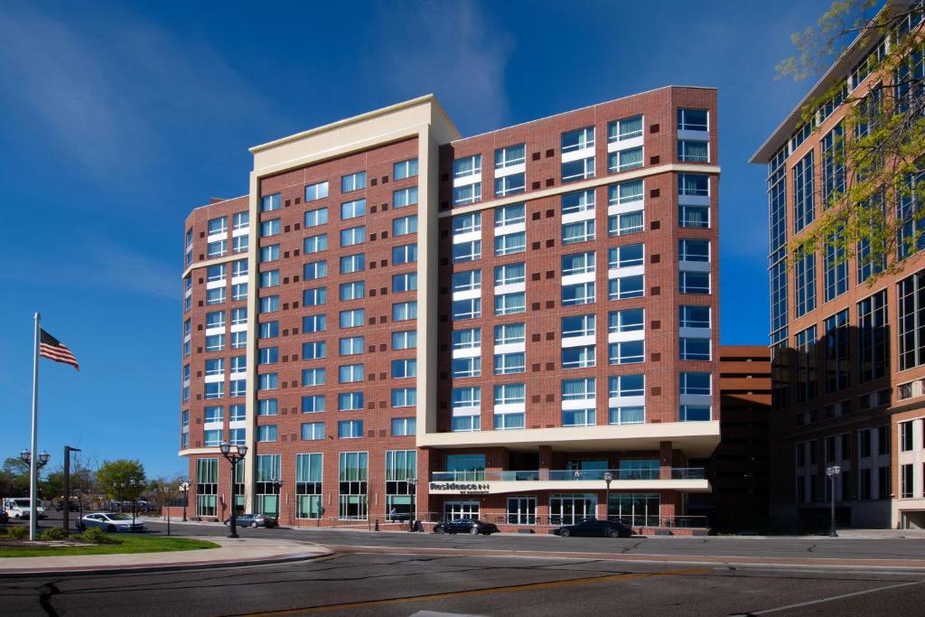 a large brick building on a city street at Residence Inn by Marriott St Louis Clayton in Clayton