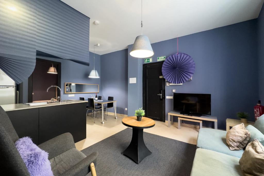 TV a/nebo společenská místnost v ubytování AinB Barcelona Sants Apartments