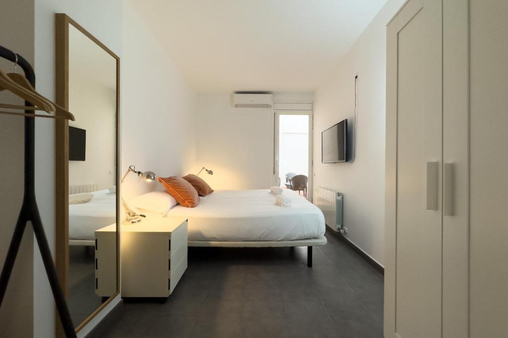Postel nebo postele na pokoji v ubytování AinB Barcelona Sants Apartments