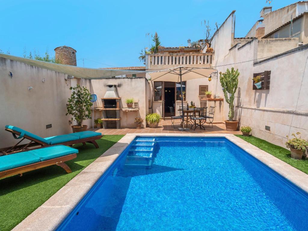 a swimming pool in the backyard of a house at Holiday Home Pueblo - PSR175 by Interhome in Porreres