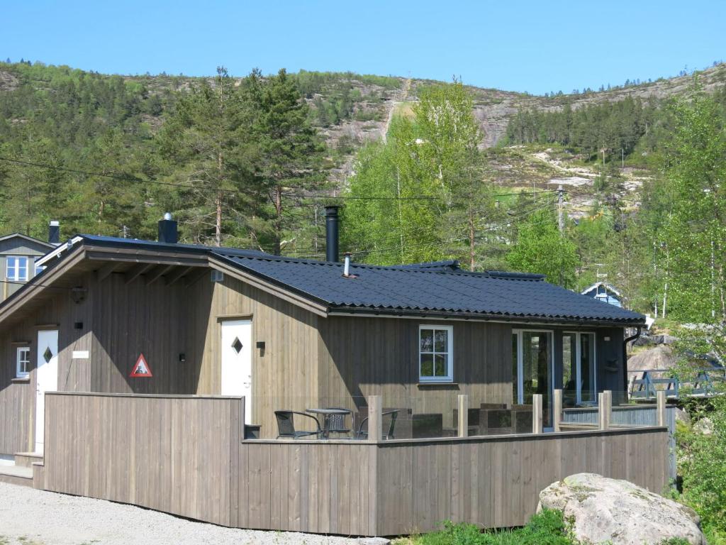 a house with a fence in front of it at Chalet Torfinnbu - SOW051 by Interhome in Øyuvstad