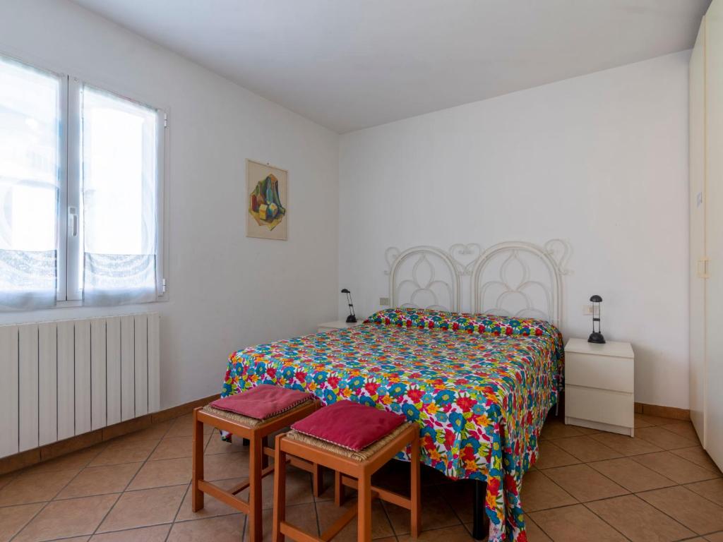 A bed or beds in a room at Apartment Sorei by Interhome