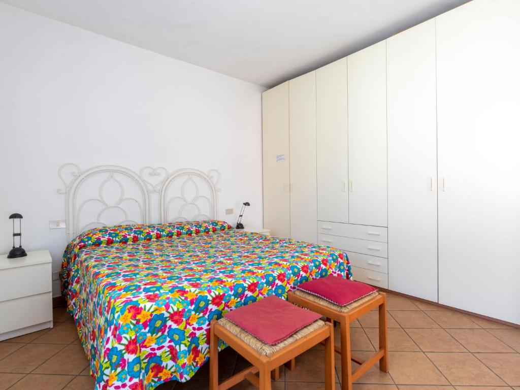 A bed or beds in a room at Apartment Sorei by Interhome