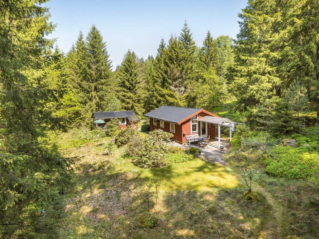 an overhead view of a small house in the woods at Holiday Home Dammeberg - HAL033 by Interhome in Karl Gustav