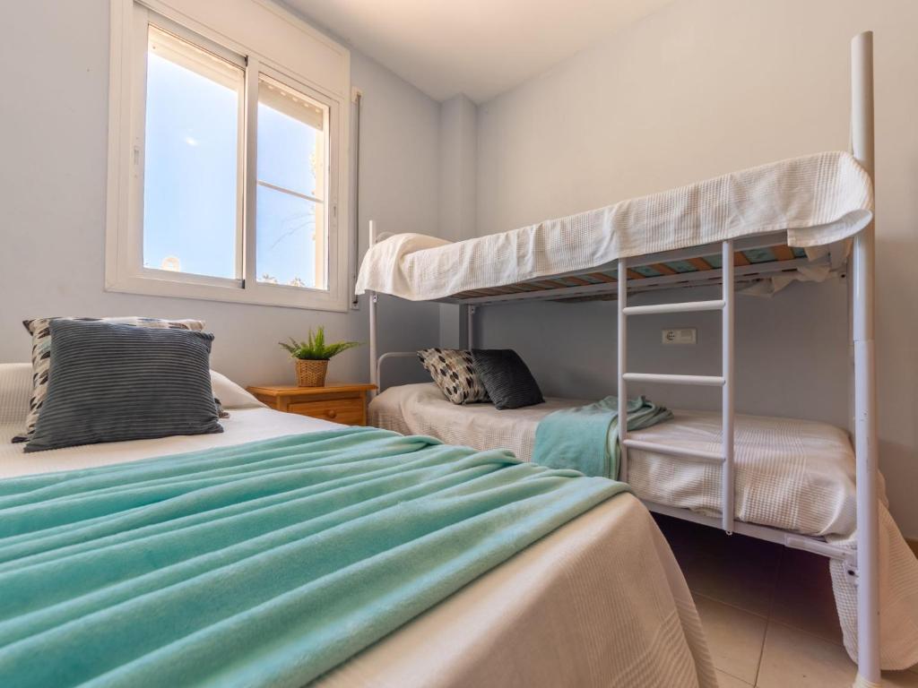 Postel nebo postele na pokoji v ubytování Apartment Res Mediterraneo-5 by Interhome