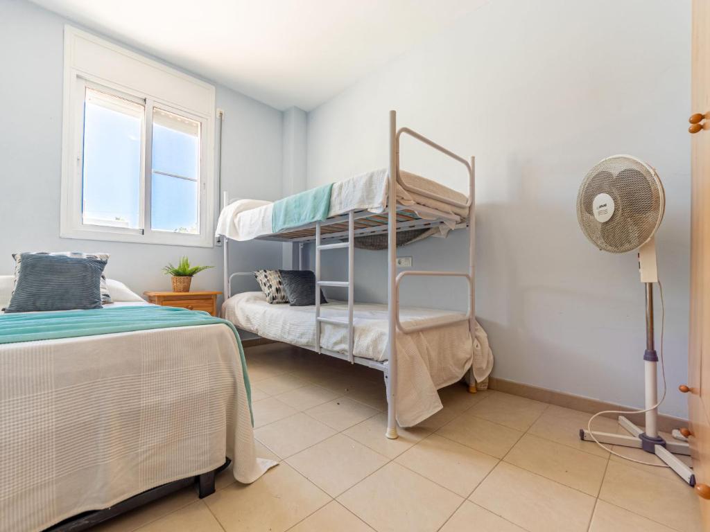 Postel nebo postele na pokoji v ubytování Apartment Res Mediterraneo-5 by Interhome