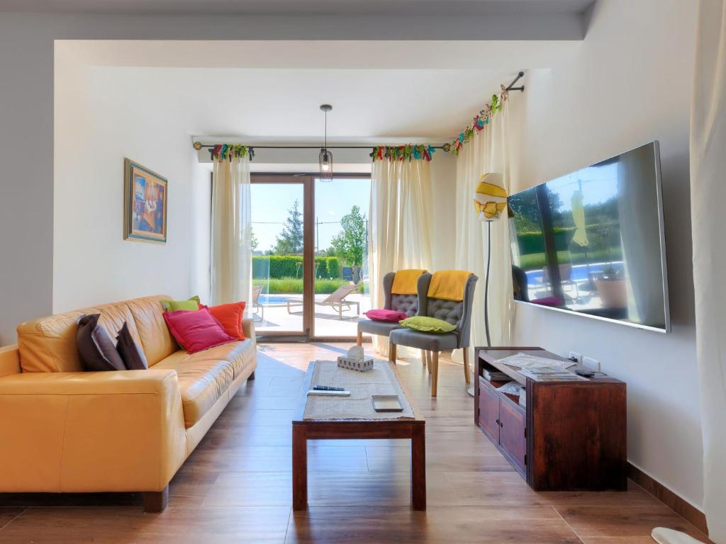 TV a/nebo společenská místnost v ubytování Holiday Home Gasparini by Interhome