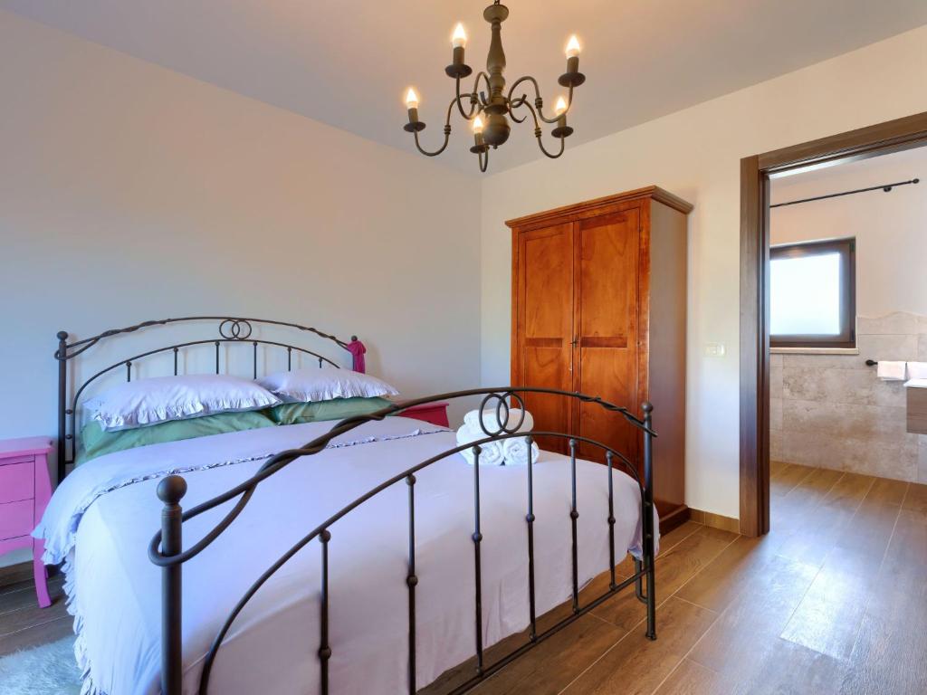 Postel nebo postele na pokoji v ubytování Holiday Home Gasparini by Interhome