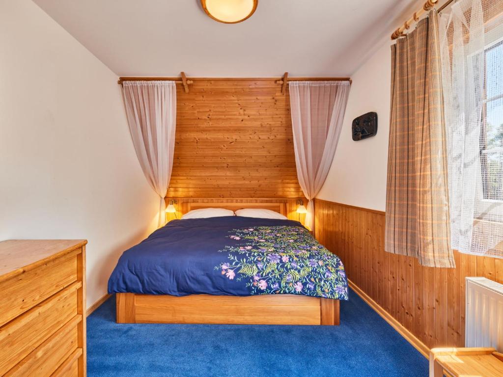 Postel nebo postele na pokoji v ubytování Chalet Krakonoš by Interhome