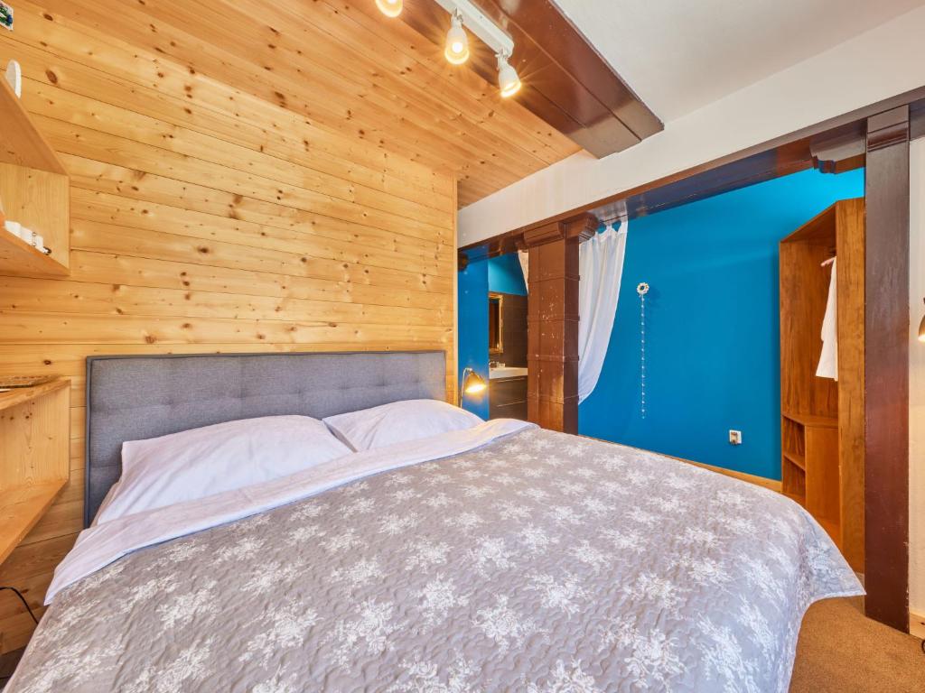 Postel nebo postele na pokoji v ubytování Chalet Krakonoš by Interhome