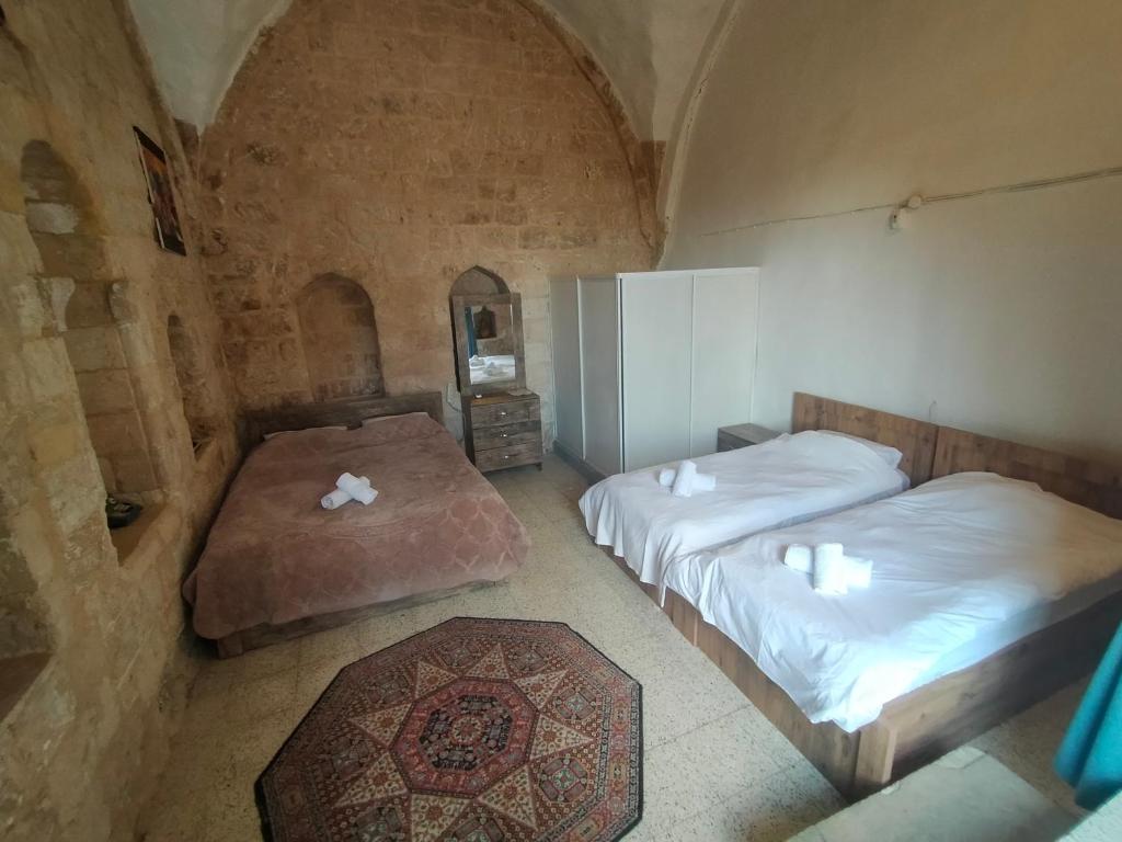 Ліжко або ліжка в номері ŞAHMARAN BUTİK OTEL