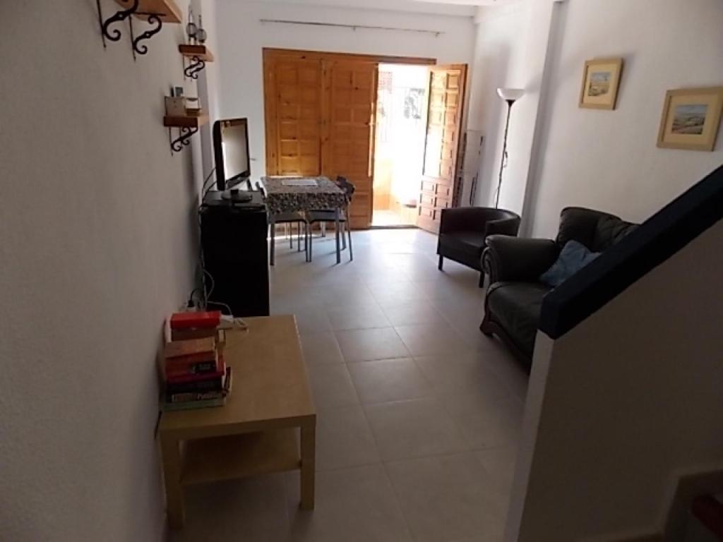 a living room with a couch and a table at Duplex Puertosol in Puerto de Mazarrón