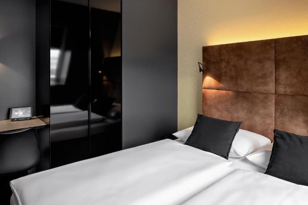 Postel nebo postele na pokoji v ubytování Hotel ZOE by AMANO
