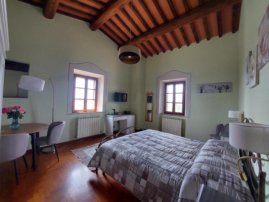 Postel nebo postele na pokoji v ubytování Podere Cacchini