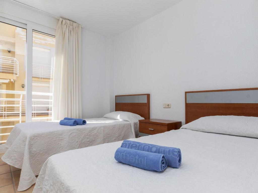 Posteľ alebo postele v izbe v ubytovaní Apartment Cala Lidia by Interhome