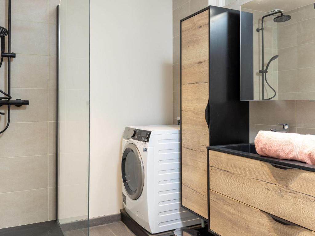 a laundry room with a washing machine in a bathroom at Apartment Plasenn by Interhome in Saint Malo