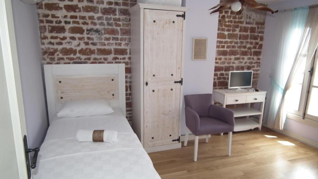 Postel nebo postele na pokoji v ubytování Gizemli Konak
