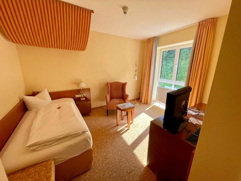 Postel nebo postele na pokoji v ubytování Hotel Burgblick