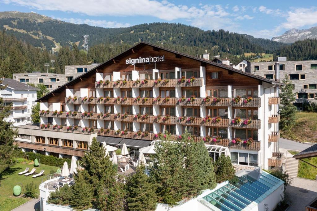 an aerial view of the symphony hotel in the mountains at signinahotel in Laax