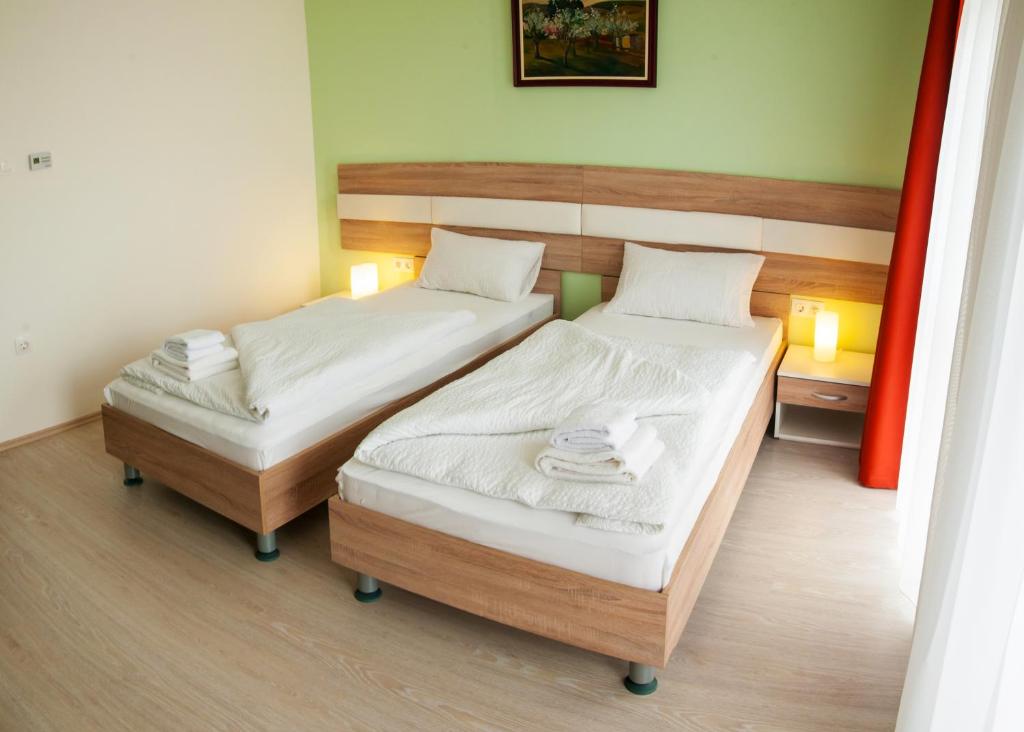 Postel nebo postele na pokoji v ubytování Hotel Pallone