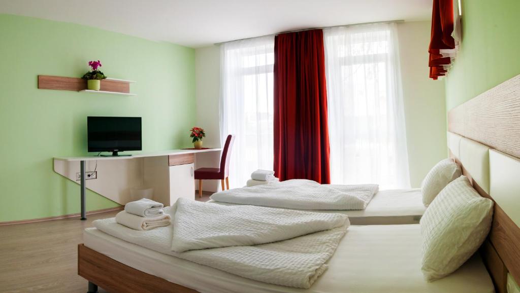 Postel nebo postele na pokoji v ubytování Hotel Pallone