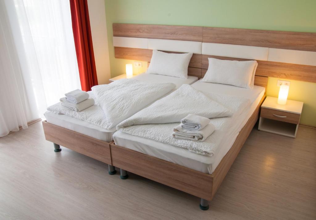 Postel nebo postele na pokoji v ubytování Hotel Pallone