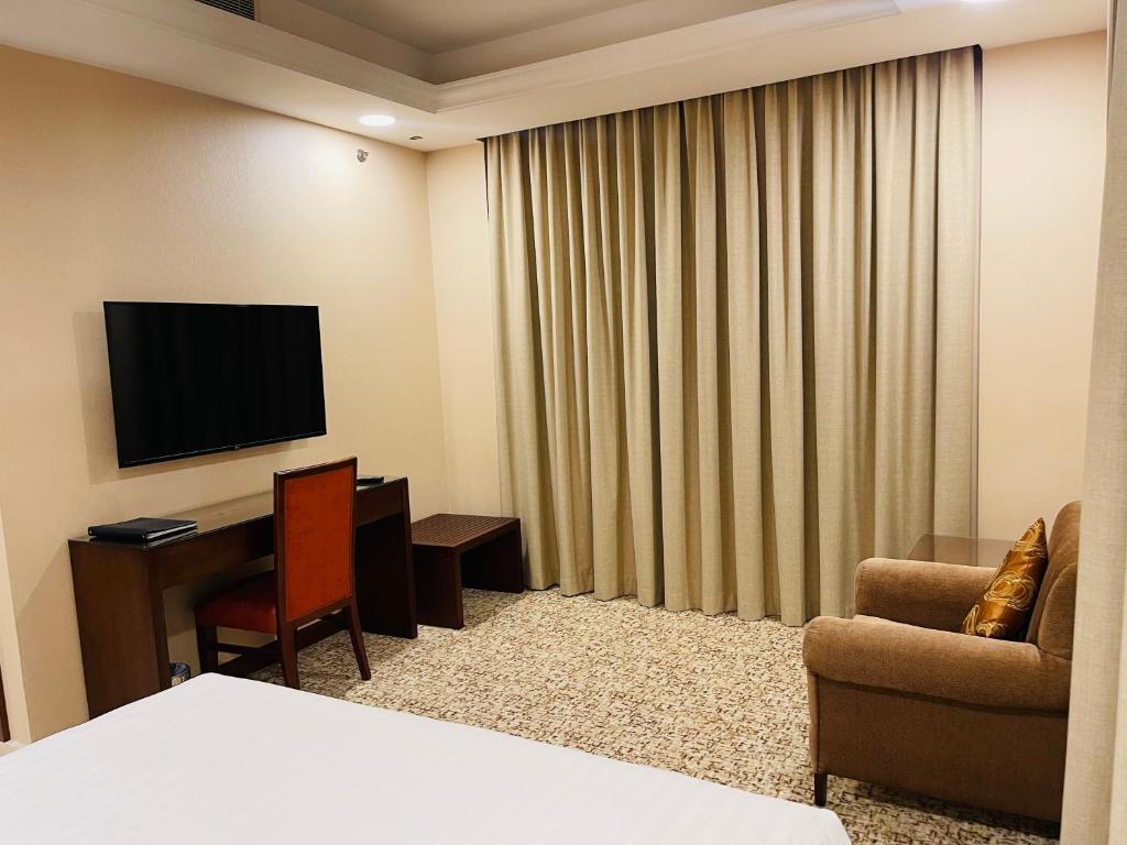 TV a/nebo společenská místnost v ubytování Grand Legacy Hotel Doha