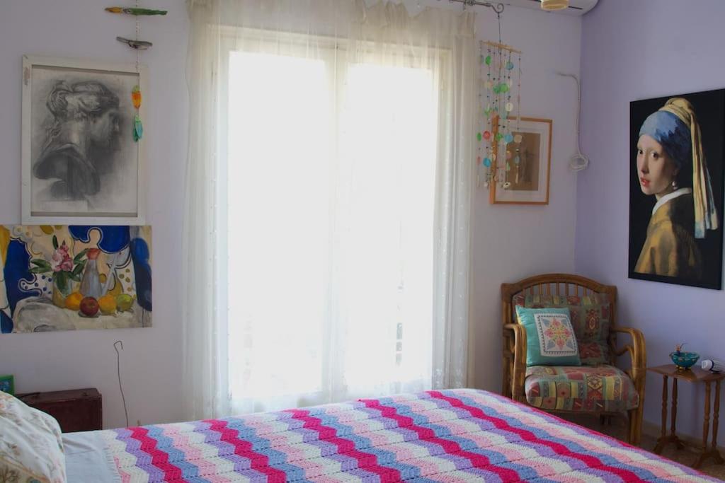 Postel nebo postele na pokoji v ubytování Sevasti Rafina