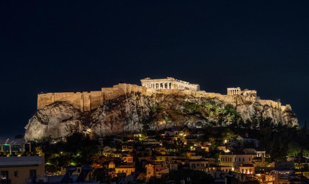 a view of the acropolis of athens at night at Acropolis Luxury Penthouses with Majestic Views in Athens