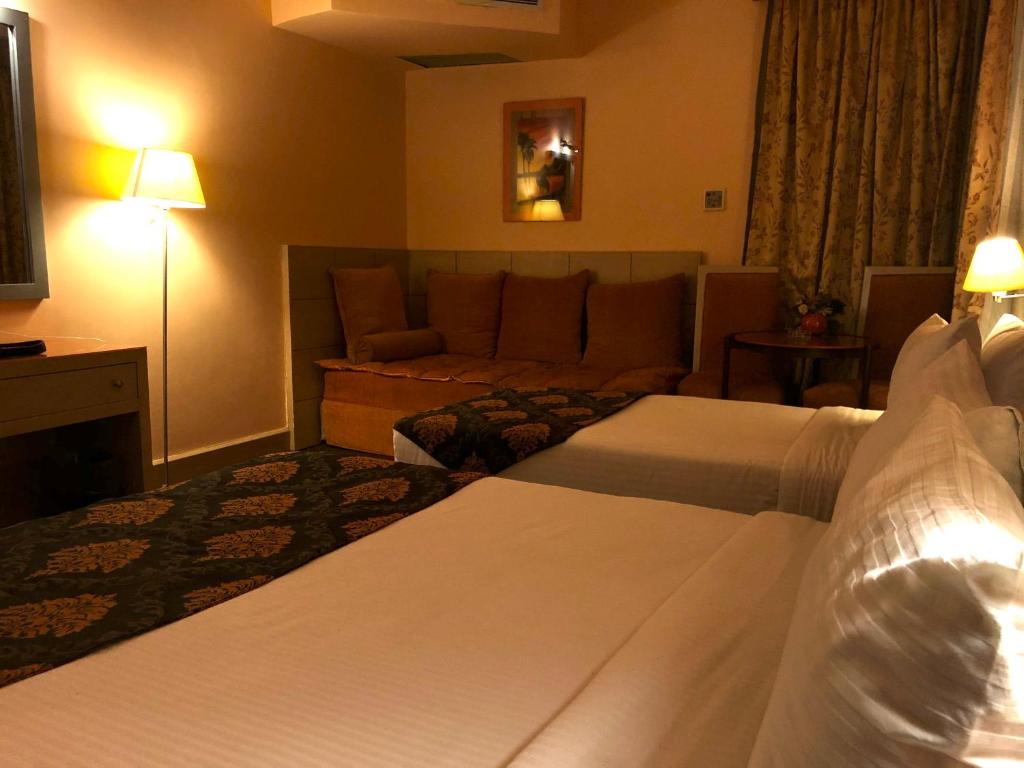 Postel nebo postele na pokoji v ubytování Santana Hotel Cairo