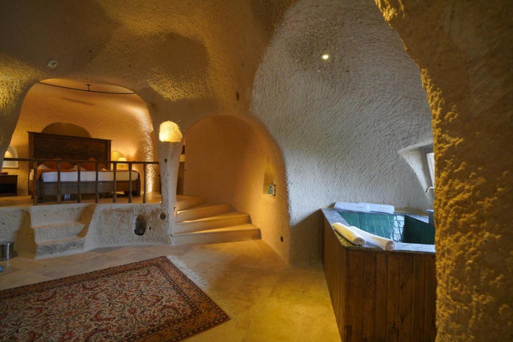 a room with a staircase in a building at Ages in Cappadocia in Uçhisar