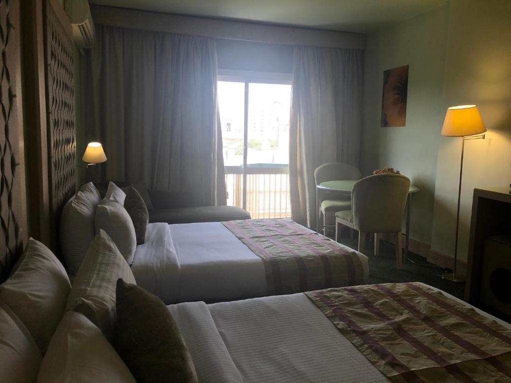 Postel nebo postele na pokoji v ubytování Santana Hotel Cairo