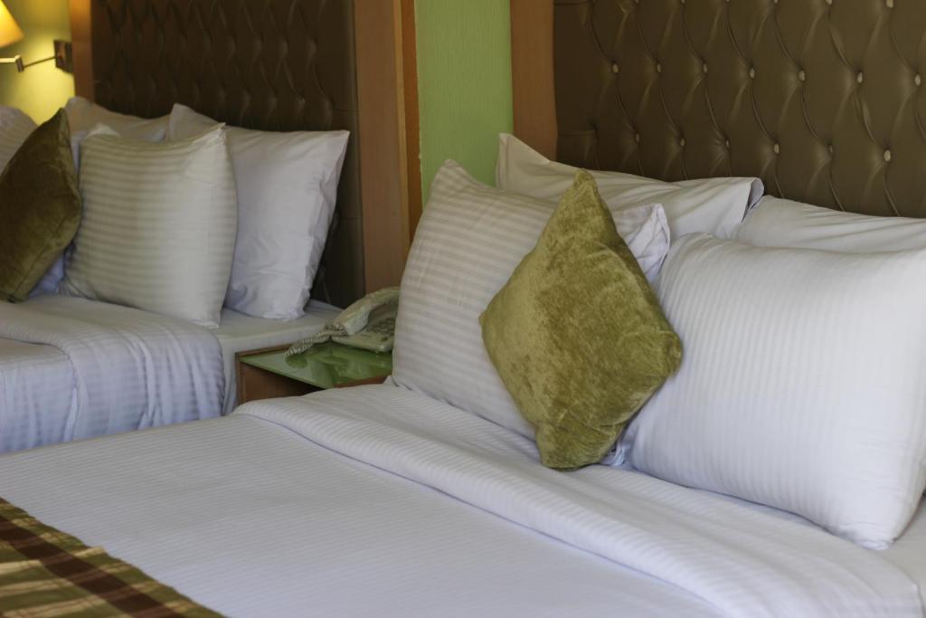 Postel nebo postele na pokoji v ubytování Santana Hotel Cairo