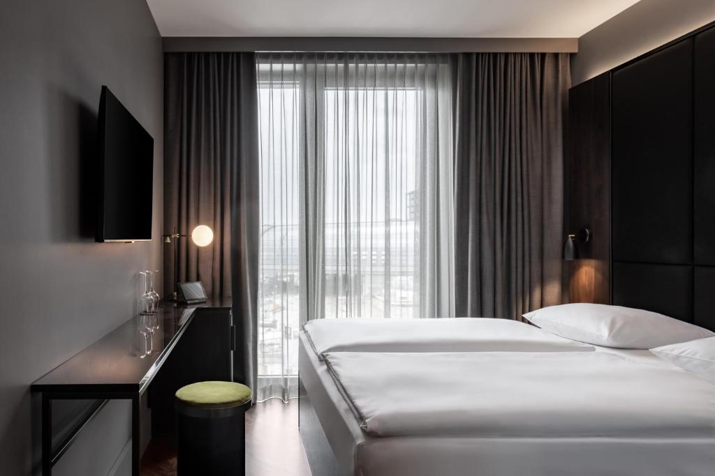 Postel nebo postele na pokoji v ubytování Hotel ROMY by AMANO