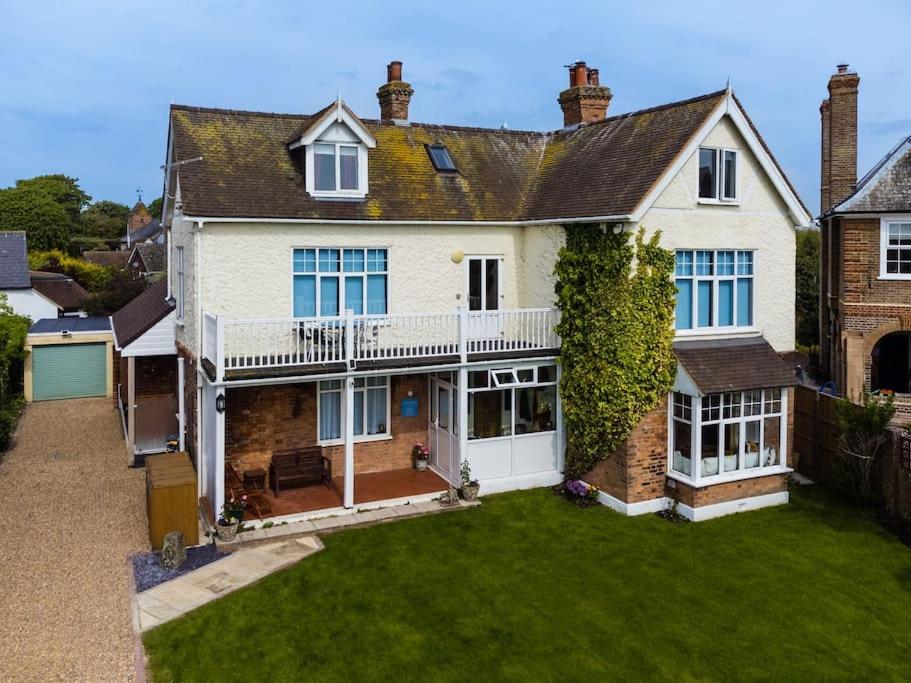 an aerial view of a house with a yard at Beachside period family home. 5 BR spacious, comfortable. in Dymchurch