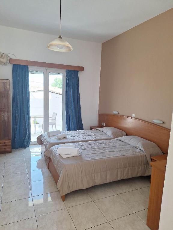 Postel nebo postele na pokoji v ubytování Two Brothers Studios Tsilivi Zakynthos