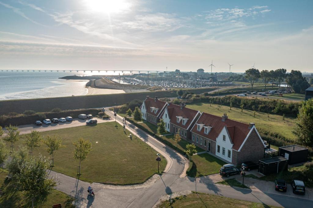 an aerial view of a house next to the beach at Parc Ganuenta in Colijnsplaat