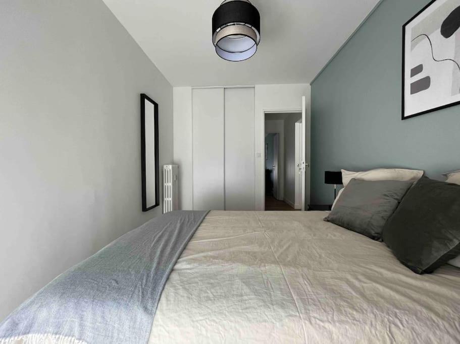 Cama ou camas em um quarto em Appartement F5 - Spacieux et lumineux