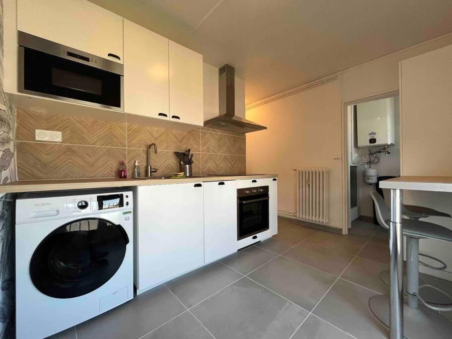A cozinha ou cozinha compacta de Appartement F5 - Spacieux et lumineux