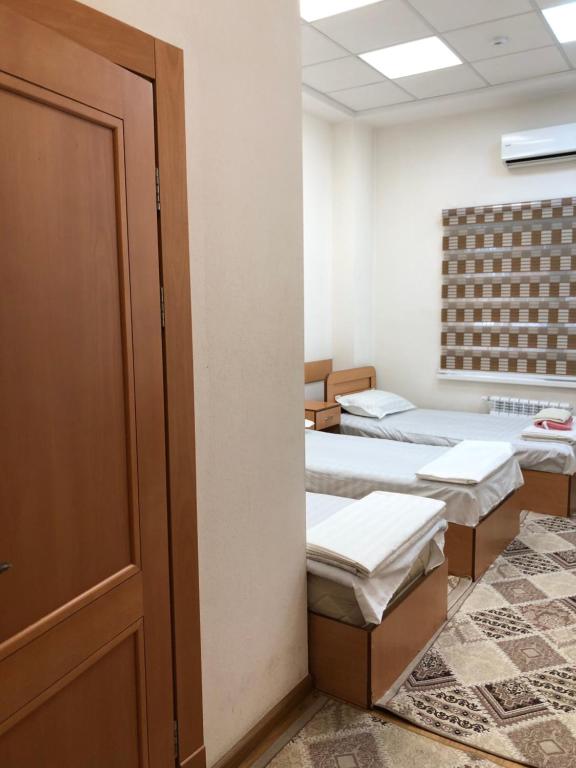 Ένα ή περισσότερα κρεβάτια σε δωμάτιο στο Отель Дружба Народов