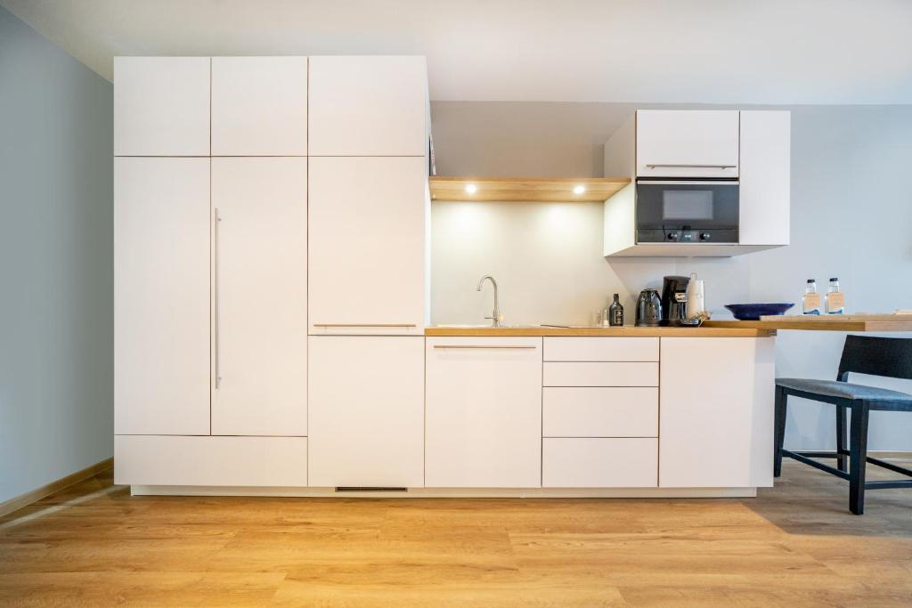 Kuchyň nebo kuchyňský kout v ubytování bodenseezeit Apartmenthotel Garni