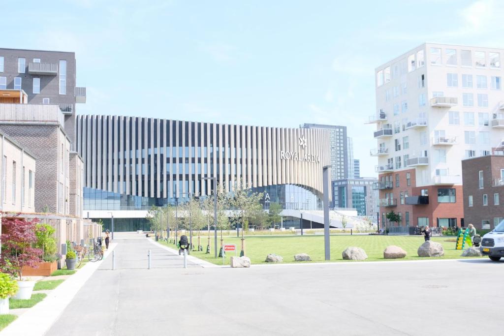 a street in a city with tall buildings at Modern Spacious 3 Bedroom Apartment At Ricahrd Mortensens Vej With Balcony Close To The Royal Arena And Fields in Copenhagen