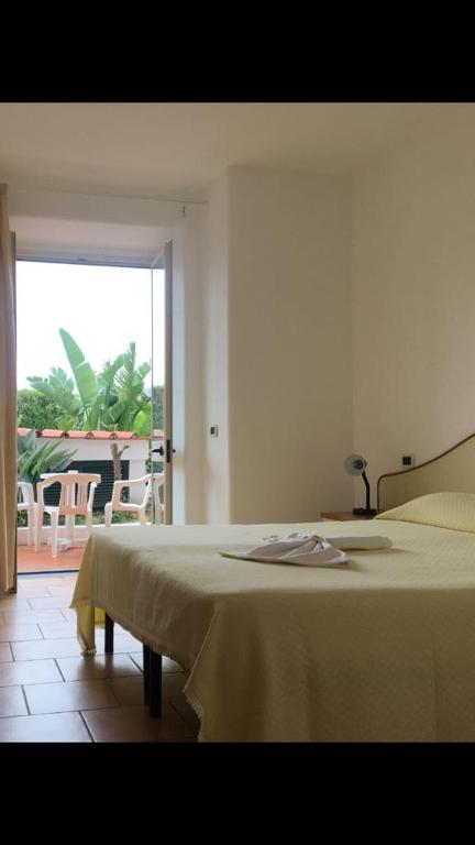 Postel nebo postele na pokoji v ubytování Hotel Casa Gerardo
