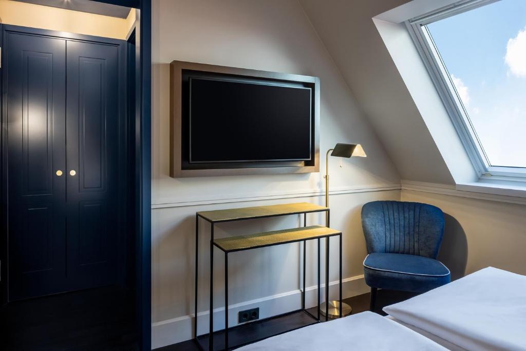 Postel nebo postele na pokoji v ubytování Hotel AMO by AMANO Friedrichstraße